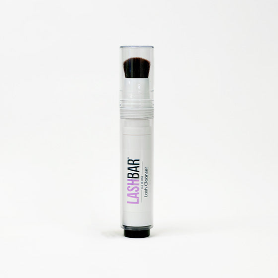 Lash cleanser with brush built into bottle