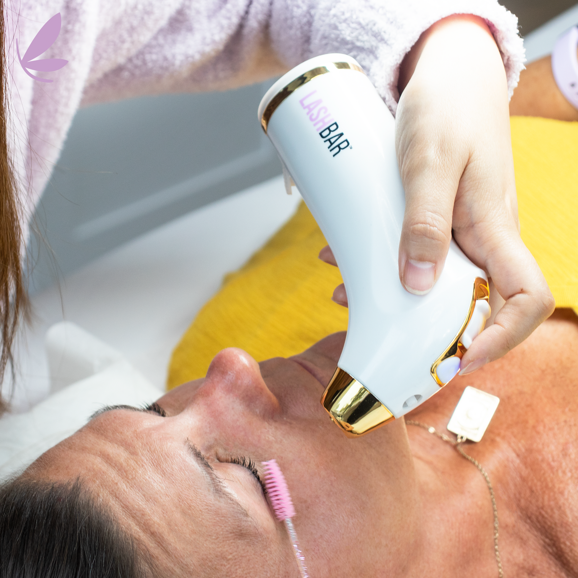 Air lash machine in use during appointment drying lash adhesive